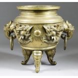 A Chinese Bronze Deep Two-Handled Censer, the sides cast with dragons chasing the sacred pearl,