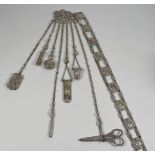 A Victorian Silvery Metal Chatelaine and Belt, the chatalaine pierced and cast with mask and leaf