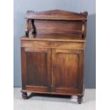 A Victorian Mahogany Chiffonier, the panel back with arched pediment with scroll brackets, fitted