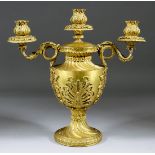 A Gilt Brass Three-Light Candelabrum, Late 19th Century, of Neo-Classical design, the urn shaped