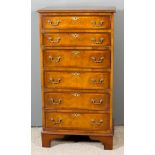 A 20th Century Walnut Chest of "18th Century" Design, the crossbanded top with moulded edge,