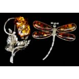 Two Amber and Silvery Coloured Metal Brooches, one in the form of a dragonfly, 42mm x 46mm, the