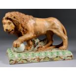 An English Pearlware Model of a Medici Lion, circa 1815, modelled in typical pose with one paw