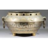A Chinese Bronze Two-Handled Bowl, 20th Century, the sides cast with archaic motifs and lappets,