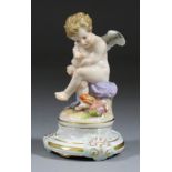 A Meissen Porcelain Figure of Seated Cupid with Heart at His Feet, 20th Century, on gilt decorated