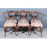 A Set of Six Victorian Rosewood Drawing Room Chairs, with shaped and moulded backs and shell and
