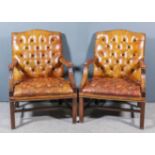 A Pair of Mahogany Framed "Gainsborough" Library Armchairs, with arched backs, the seats, backs