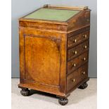 A Victorian Walnut Davenport, with brass gallery to top and green leather lined slope, enclosing