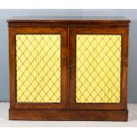 A Regency Rosewood Chiffonier, with square top edge, fitted two shelves enclosed by a pair of