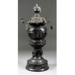 A Japanese Bronze Lantern of Pagoda Form, 20th Century, the stem cast with single dragon clutching