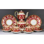 A Davenport Porcelain Part Tea Service, circa 1850, with gilt decoration on a claret ground, pattern