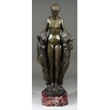 Rubin - Green patinated bronze figure of a standing naked woman holding a robe, on circular base and