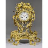 A mid 19th Century French Gilt Brass Cased Mantel Clock of Louis XV design, the 3.5ins diameter