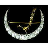 A Diamond Crescent Pattern Brooch, Early 20th Century, in platinum and gold mount, set with twenty-