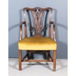 A Mahogany Armchair of "Country Chippendale" Design, with shaped crest rail, fretted splat, seat