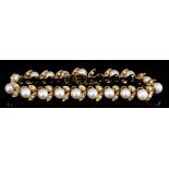 A 14ct Gold and Pearl Bracelet, Modern, set with eighteen cultured pearls interspersed with eighteen