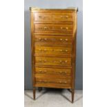 A Late 19th Century French Mahogany Semainier, the top with pierced brass gallery enclosing white