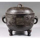 A Chinese Bronze Two-Handled Food Container and Cover, Yuan/Ming, cast with a stylised design,