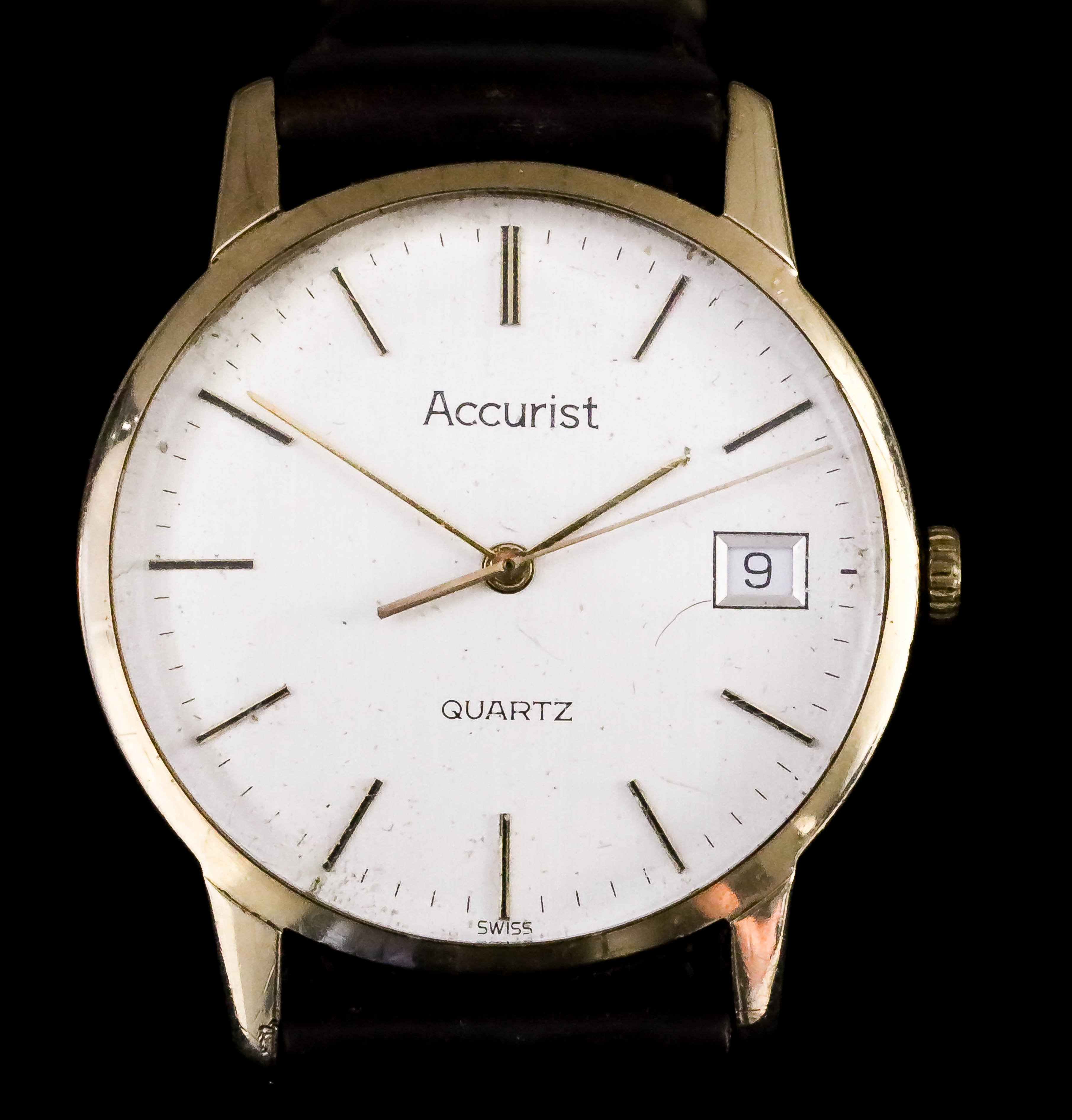 An Accurist Quartz Wristwatch, Modern, 9ct Gold Cased, the silvered dial with gold baton numerals,