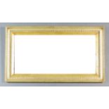 A Gilt Framed Rectangular Wall Mirror, with moulded frame and inset with plain mirror plate, 21ins x