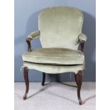 A George III Mahogany Armchair of "French Hepplewhite" Design, the arched back, seat and armpads