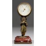 A French Desk Aneroid Barometer, 19th Century, supported on a gilt metal standing figure of a