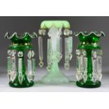 A Pair of Green Glass Lustre Vases, 19th Century, hung with prismatic drops, 8.5ins high, and a