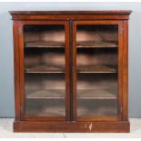 A Late Victorian Mahogany Dwarf Bookcase, with square top edge, fitted three shelves enclosed by a