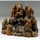 I* A Chinese Carved Bamboo Mountain Group, depicting a pavilion, figures and trees against a