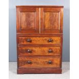 A Victorian Mahogany Cabinet on Chest, the upper part with moulded cornice enclosed by a pair of