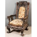 A Good 19th Century Burmese Rosewood Open Armchair, the whole boldly fretted and carved with