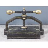 A Victorian Brass Mounted and Heavy Japanned Cast Iron Book Press, by Whitehead & Morris & Co.