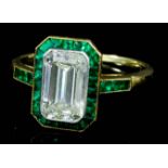 A Diamond and Emerald Ring, Early 20th Century, in 18ct gold mount, set with central octagonal cut