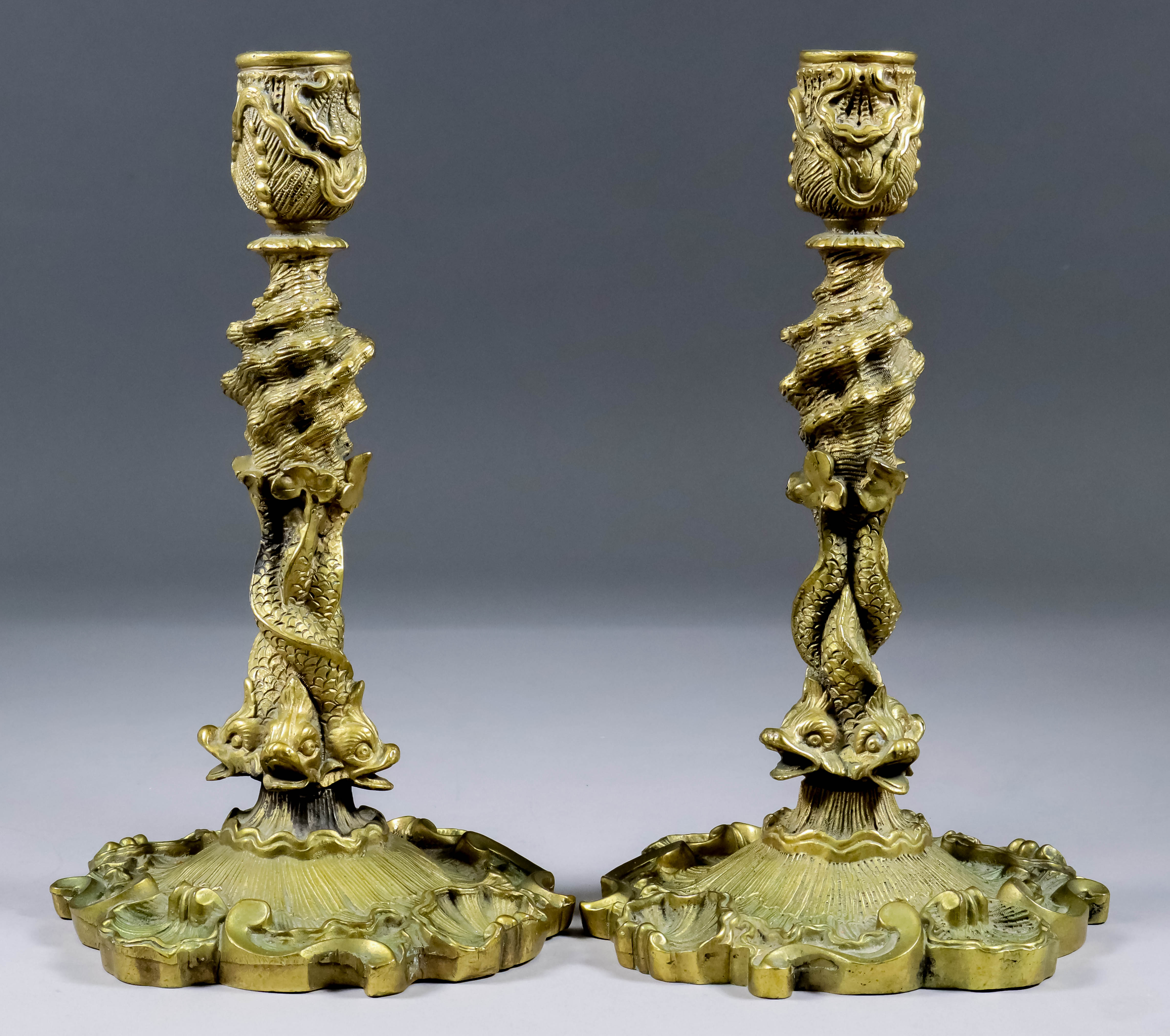 A Pair of Continental Cast Brass Pillar Candlesticks of Rococo Form, 20th Century, the column of