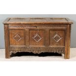 A 17th Century Panelled Oak Coffer, with three panels to top, three panels to front carved with