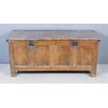 A Late 17th/Early 18th Century Panelled Oak Coffer, with plain two plank top and four fielded panels