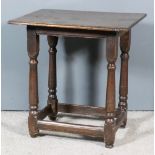 A 17th Century Oak Occasional Table, the two-plank top with moulded front and reverse (joiners stamp