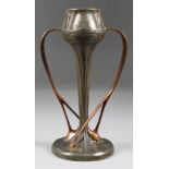 A Tudric Pewter and Copper Twin-Handled Tulip Vase, No. 029, designed by Archibald Knox for