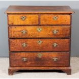 An 18th Century Oak Chest, with moulded edge to top and rounded front corners, fitted two short