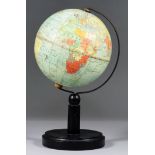 A Philips 6ins diameterTerrestrial Globe, Early 20th Century, printed in colours with plain turned