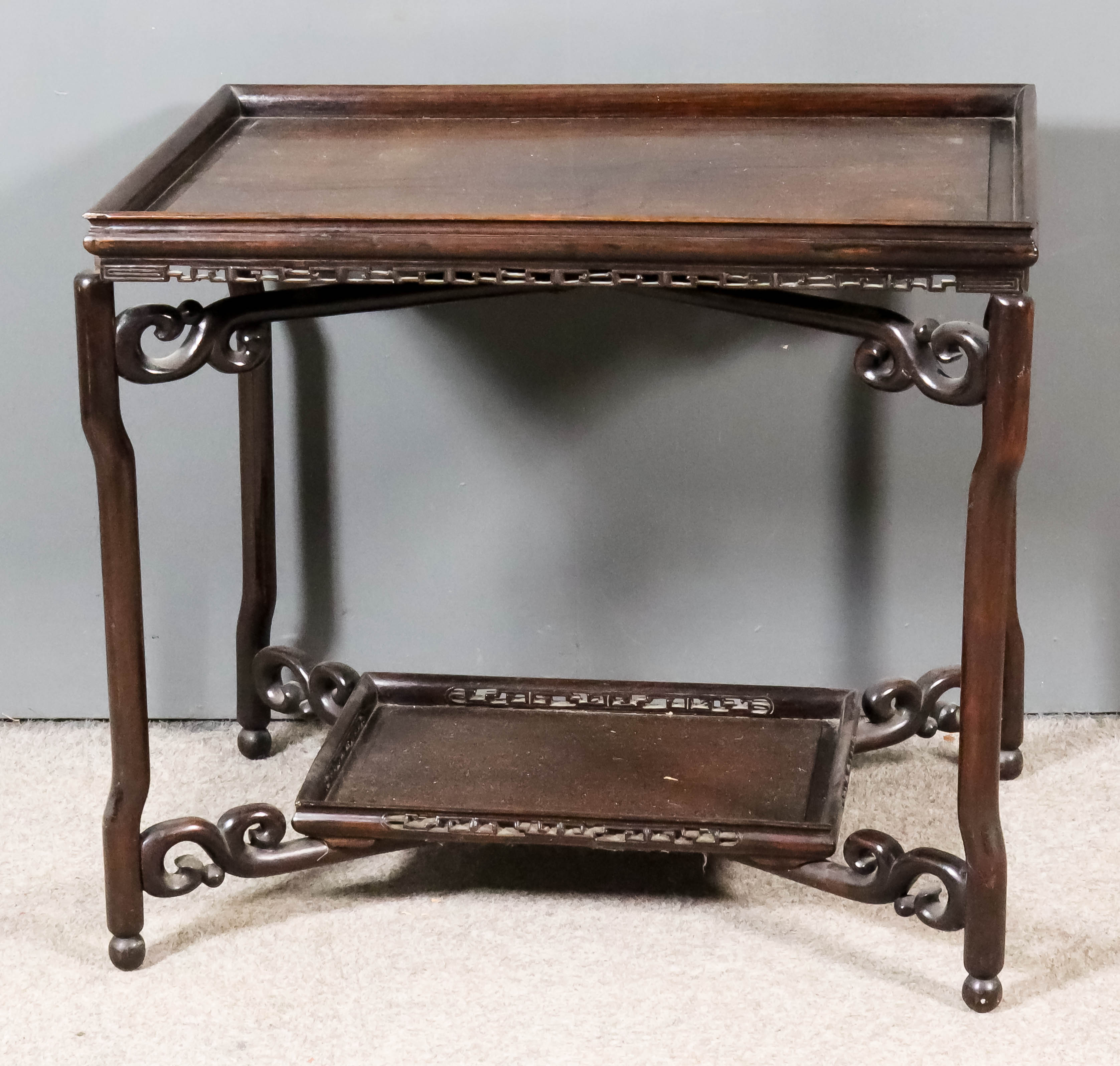 A Chinese Hardwood Rectangular Two-Tier Tray Top Occasional Table, with panelled tiers, pierced