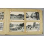 Two Early 20th Century Postcard Albums, the large album with black and white views of Paris, and