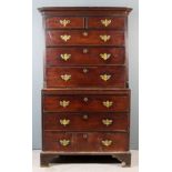 A George III Mahogany Tallboy, the upper part with moulded cornice, fitted two short and three