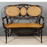 An Austrian Bentwood and Cane Panel Three Seat Settee, by Jacob & Josef Kohn of Wsetin, Austria, the