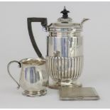 An Edward VII Silver Hot Water Jug, by the Goldsmiths & Silversmiths Co. Ltd, London 1902, with