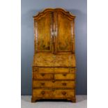 A George II Walnut Bureau Cabinet, the whole veneered in figured walnut and inlaid with