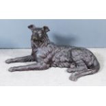 20th Century School - Bronze model of a recumbent hound, 17.5ins high