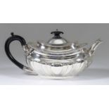 A Late Victorian Silver Oval Tea Pot, maker's mark indistinct, London 1900, with partly lobed body