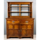 A Victorian Oak Dresser of 17th Century Design, the upper part with moulded cornice, fitted two open