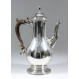 A George III Silver Baluster Shaped Coffee Pot, by Charles Wright, London 1776, the domed lid with